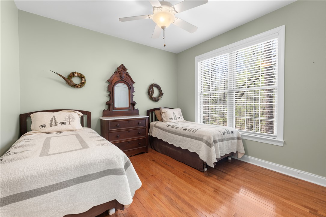 3 Halyard Way Salem, SC 29676 - Photo 28 of 48 This spacious bedroom features ample natural light and rich hardwood flooring.