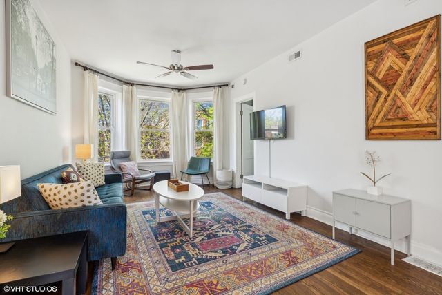 a living room with furniture and a rug