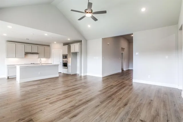 a view of kitchen with wooden floor and a kitchen