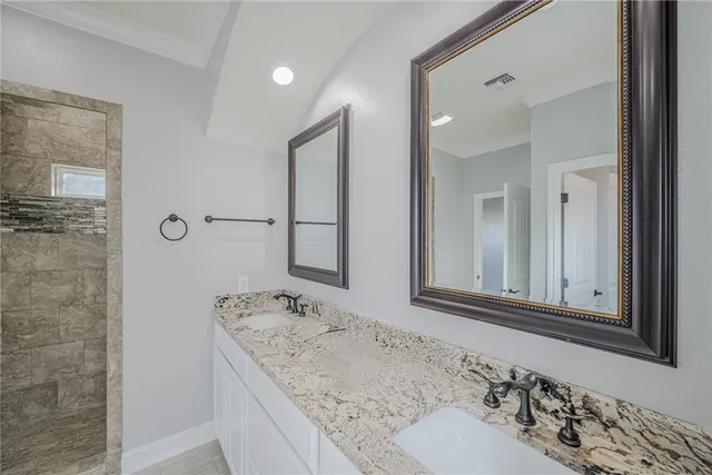 a bathroom with a shower and a sink