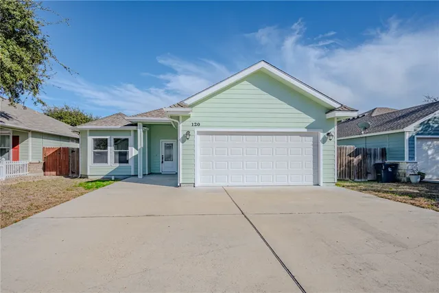 a view of entrance gate of a house