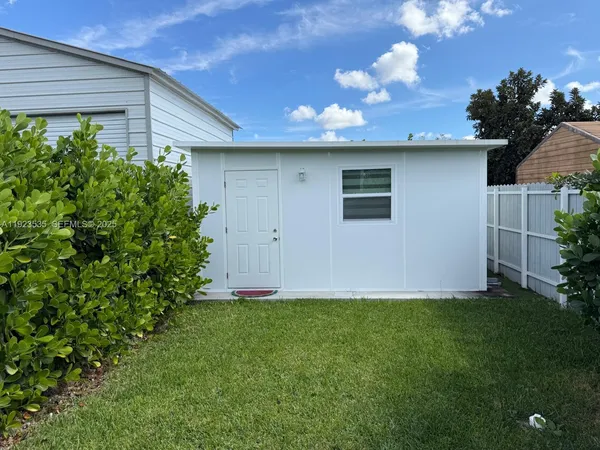 a view of a backyard of the house