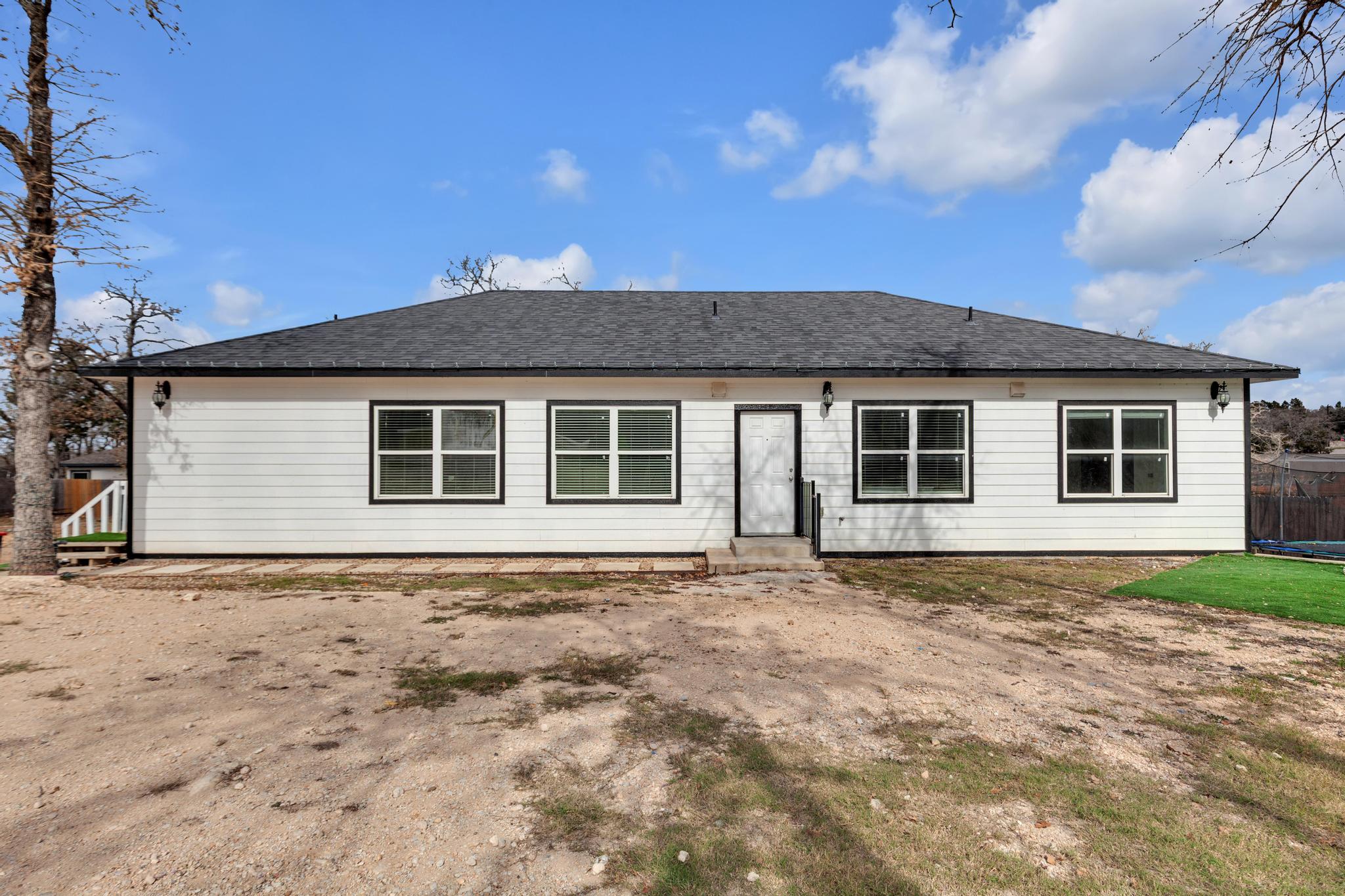 114 Crepe Myrtle Parkway Elgin, TX 78621 - Photo 1 of 40 Rear view of property with roof with shingles