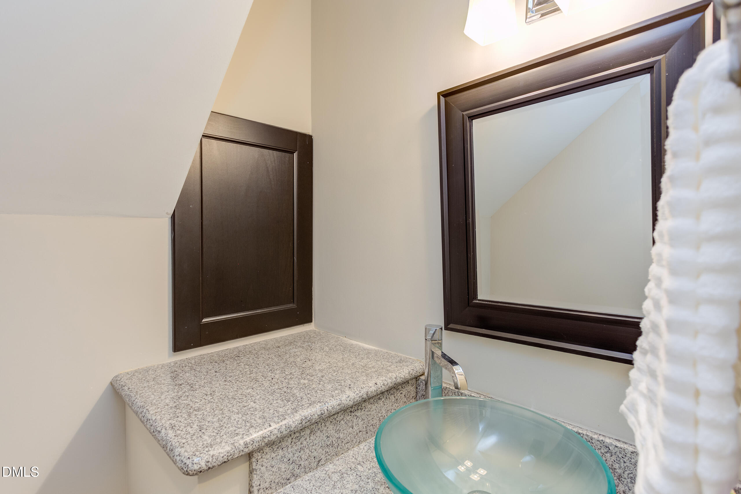 2556 Noble Road Raleigh, NC 27608 - Photo 15 of 29 a bathroom with a granite countertop sink and a mirror
