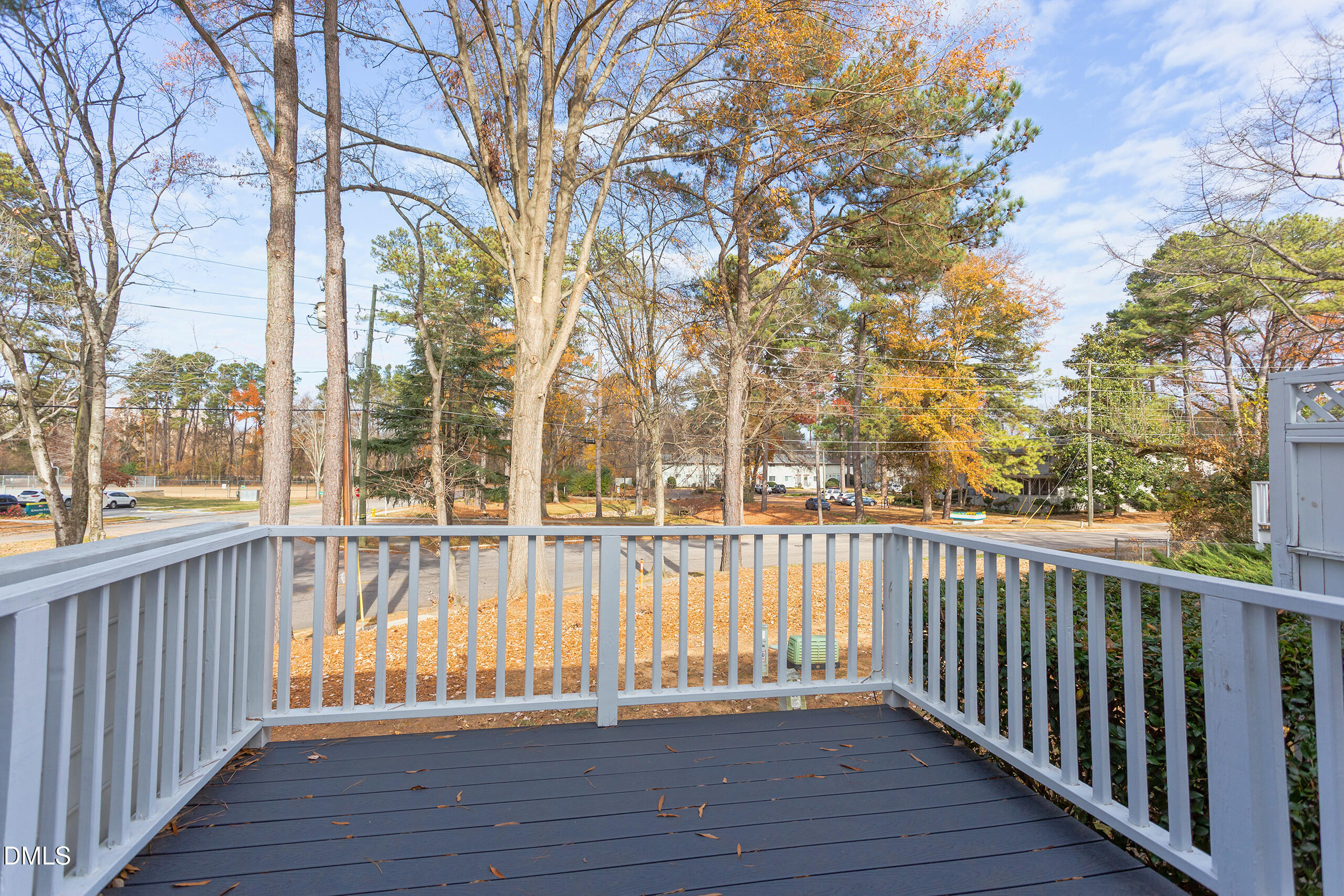 2556 Noble Road Raleigh, NC 27608 - Photo 26 of 29 a view of balcony with wooden floor and fence