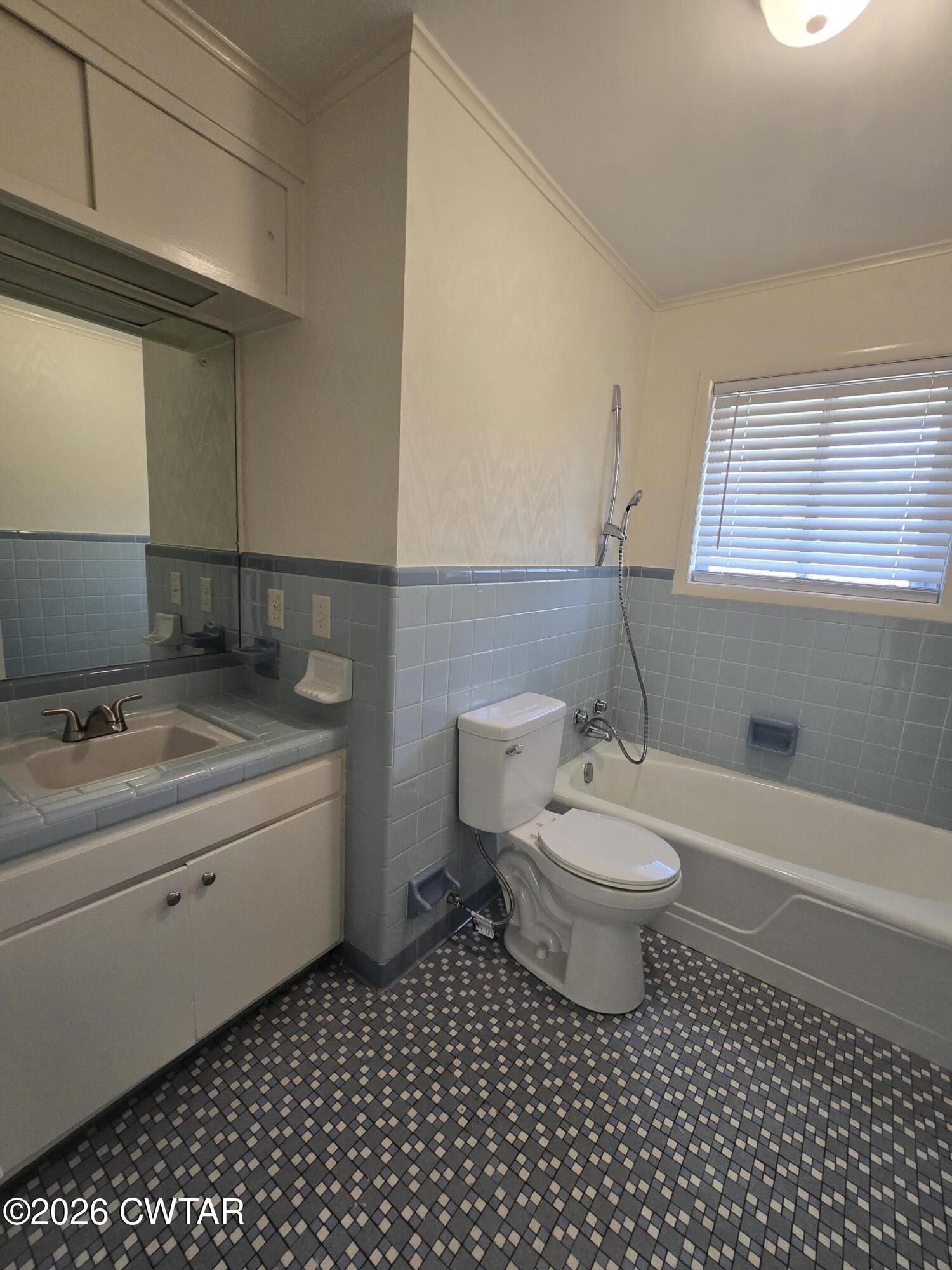 69 Lilac Lane Jackson, TN 38301 - Photo 14 of 23 a bathroom with a sink a toilet and a bathtub