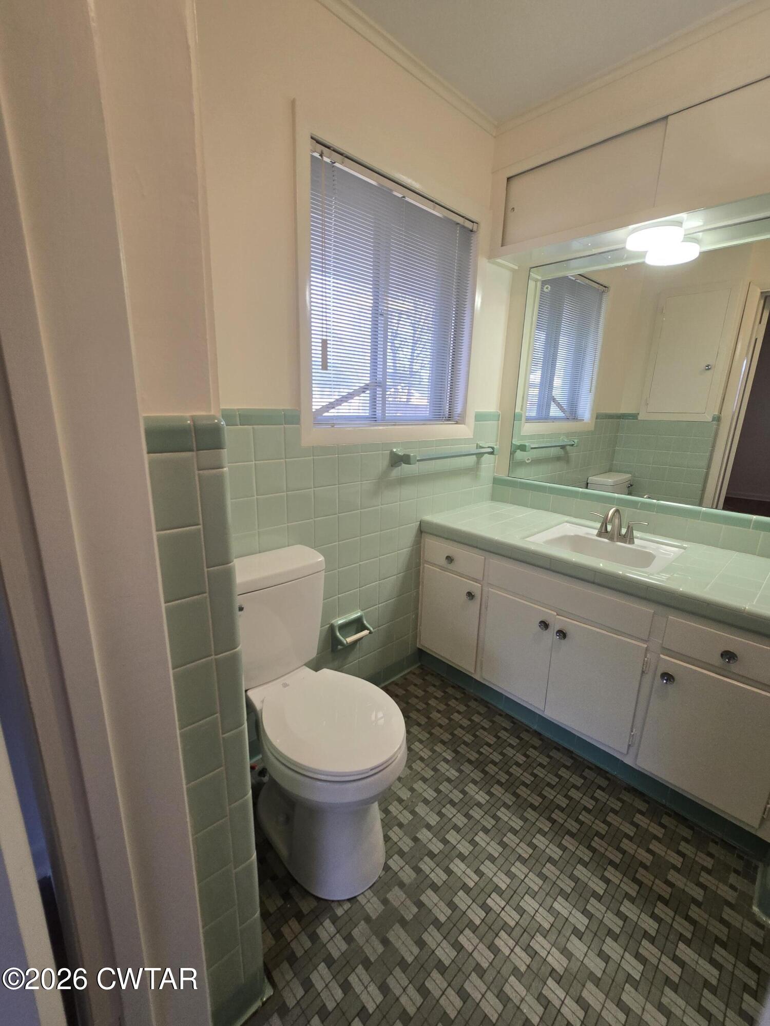 69 Lilac Lane Jackson, TN 38301 - Photo 18 of 23 a bathroom with a sink toilet and mirror