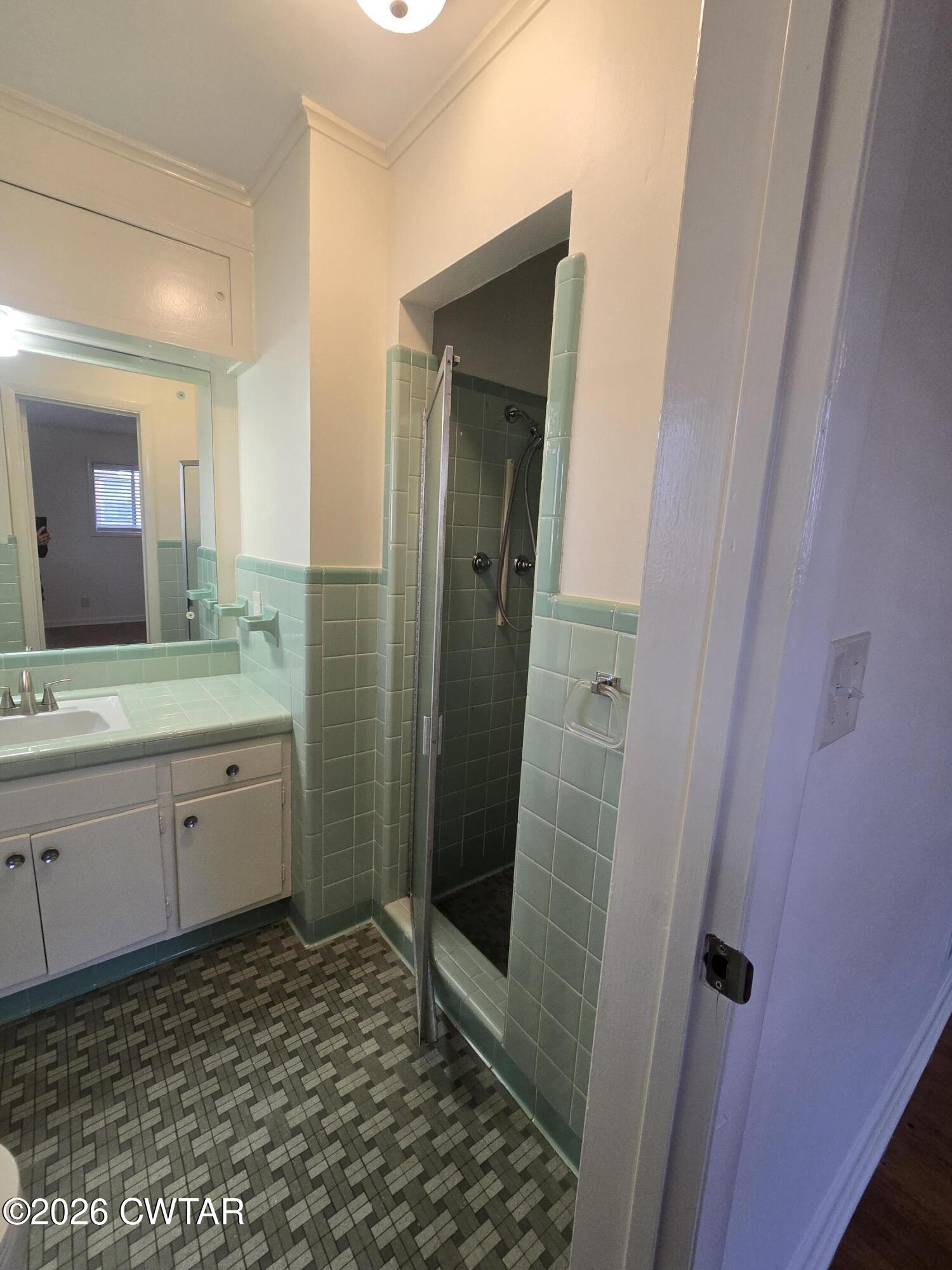 69 Lilac Lane Jackson, TN 38301 - Photo 19 of 23 a bathroom with a granite countertop sink toilet and shower