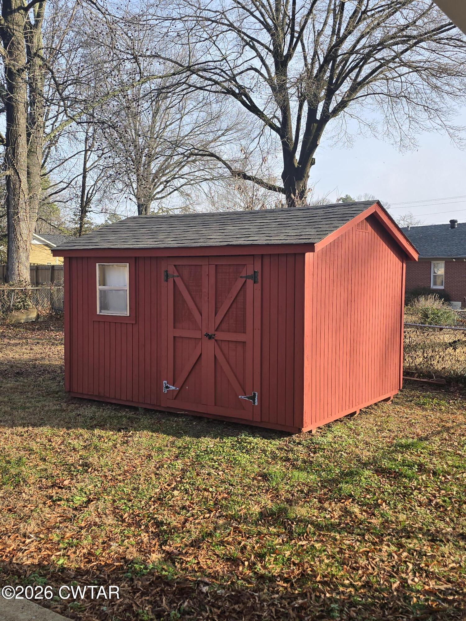 69 Lilac Lane Jackson, TN 38301 - Photo 23 of 23 a view of backyard with large tree and wooden fence