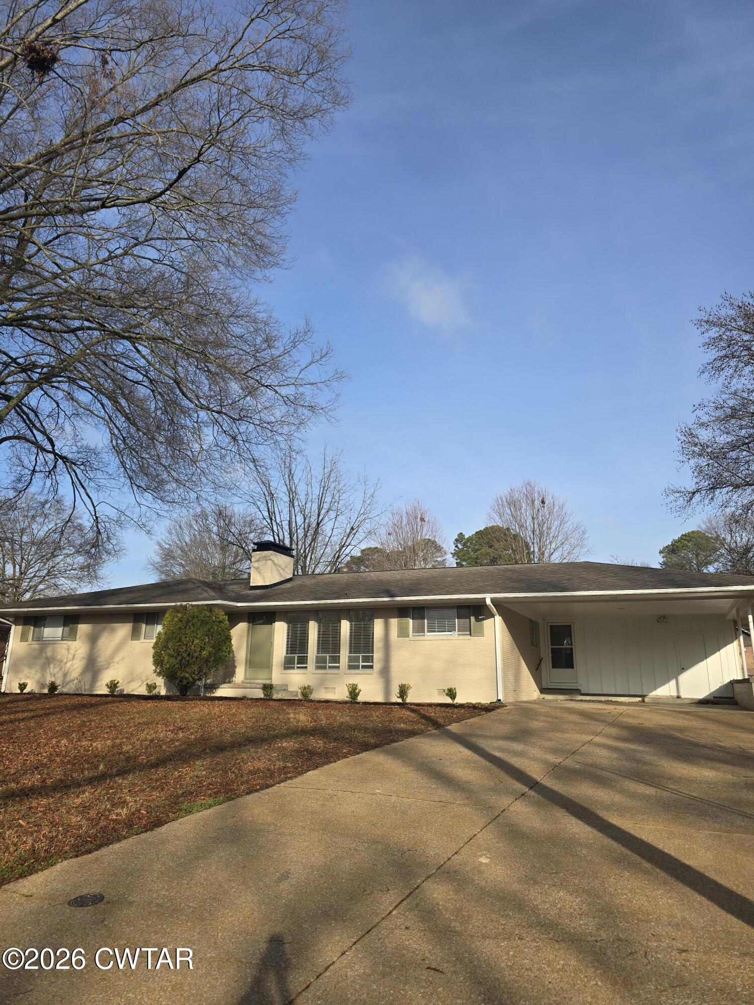 69 Lilac Lane Jackson, TN 38301 - Photo 3 of 23 a front view of a house with a yard and balcony