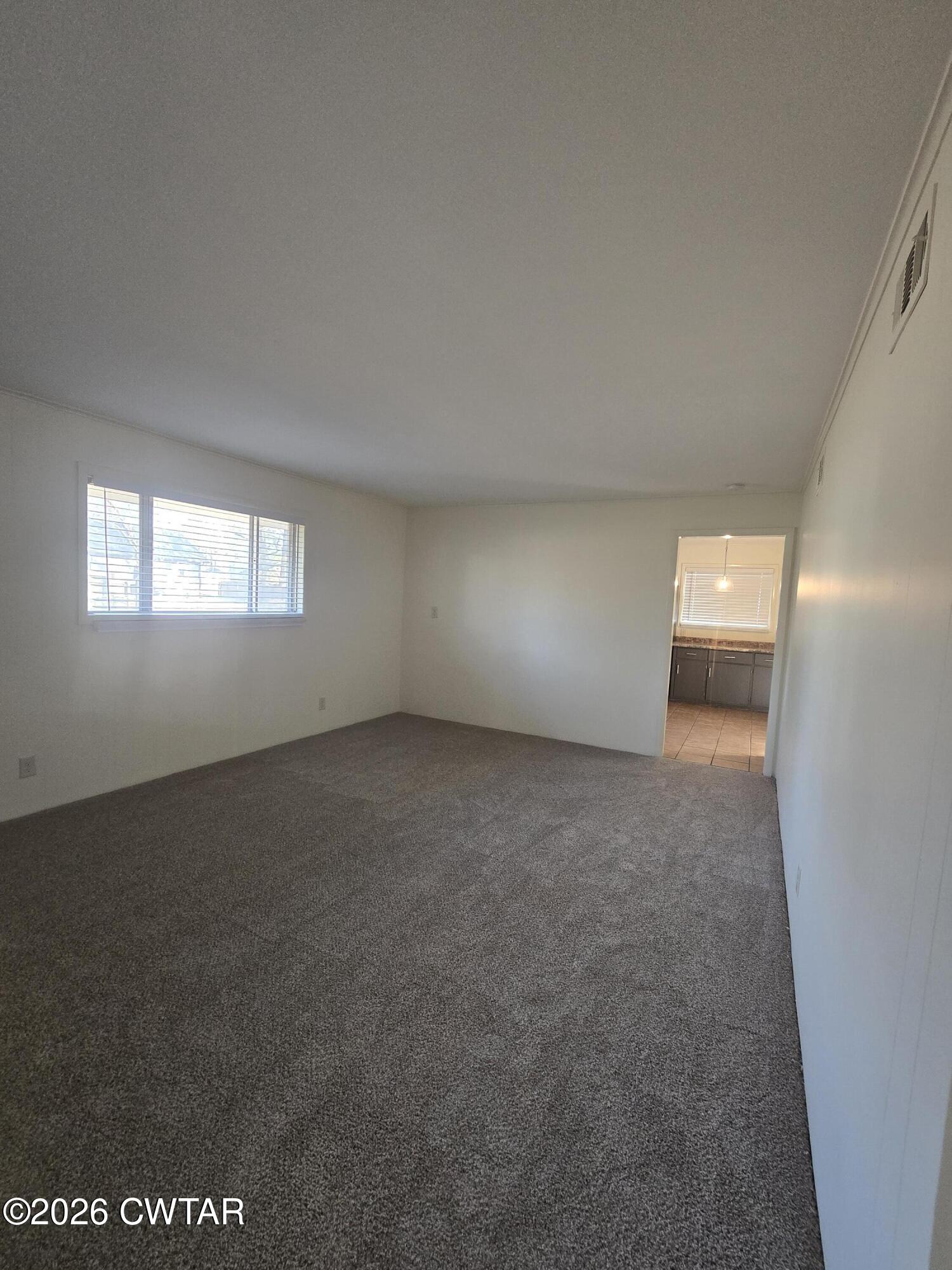 69 Lilac Lane Jackson, TN 38301 - Photo 8 of 23 a view of empty room with window