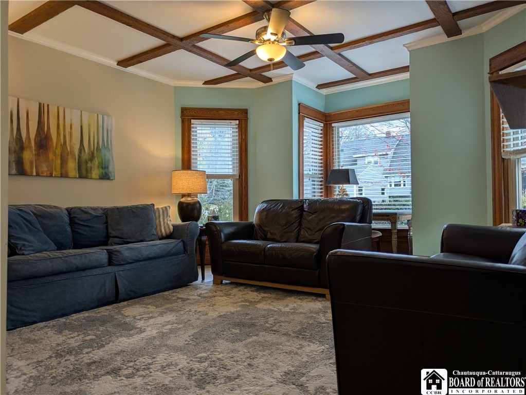 33 Maple Street Ellery, NY 14712 - Photo 3 of 40 Living room has oak flooring and windows across th