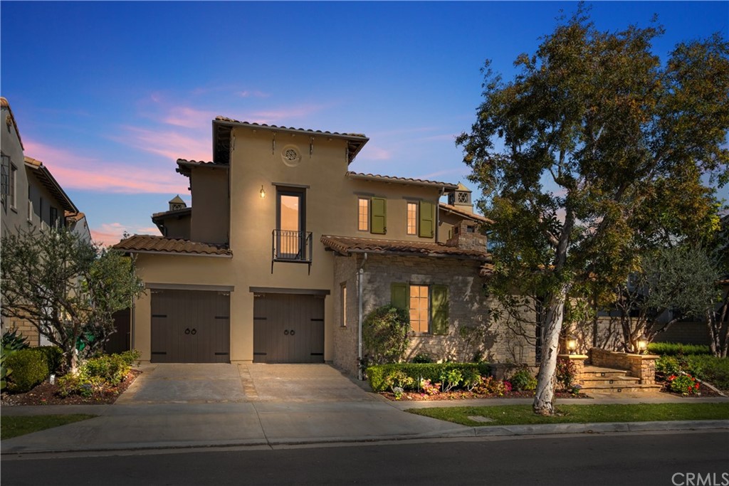 front view of a house with a tree