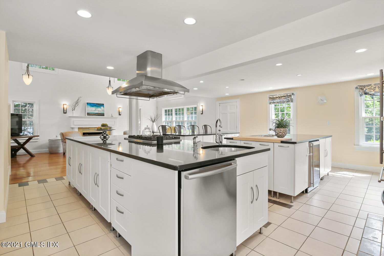 61 River Road Weston, CT 06883 - Photo 12 of 35 a kitchen with stainless steel appliances a sink stove and cabinets