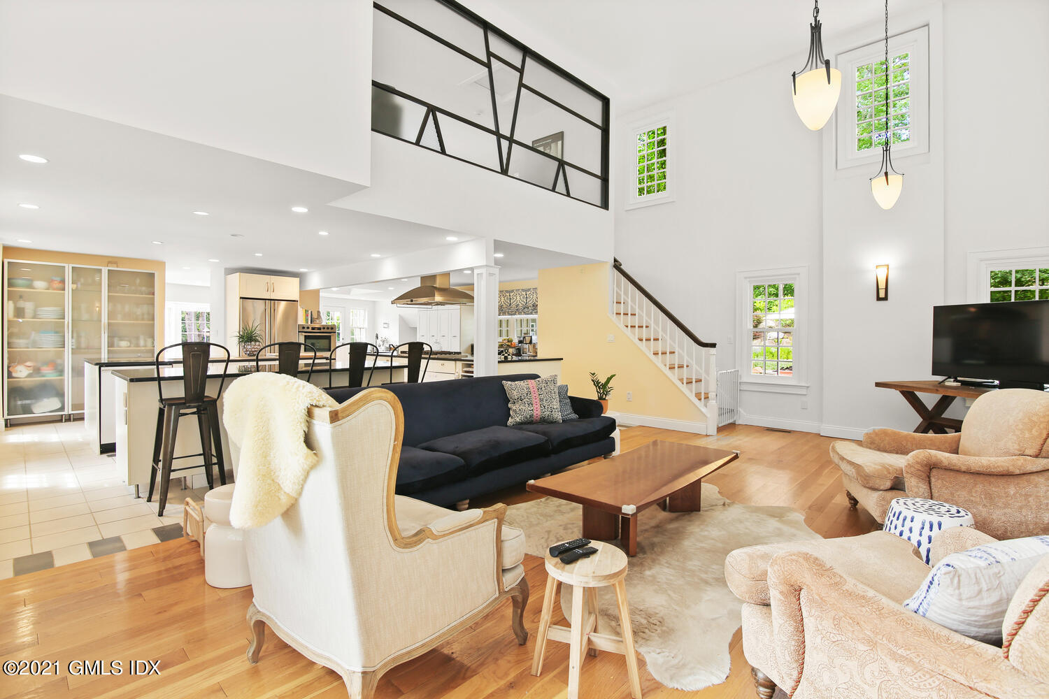 61 River Road Weston, CT 06883 - Photo 15 of 35 a living room with furniture kitchen view and a chandelier