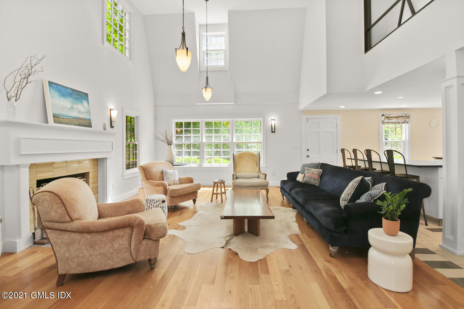 61 River Road Weston, CT 06883 - Photo 16 of 35 a living room with fireplace furniture and a wooden floor