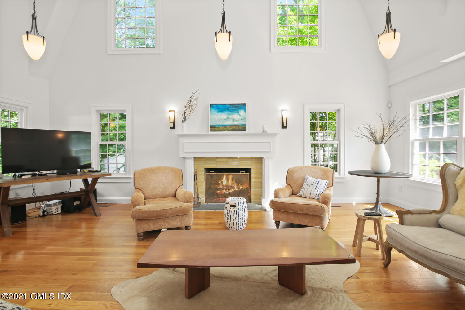 61 River Road Weston, CT 06883 - Photo 17 of 35 a living room with furniture and a flat screen tv