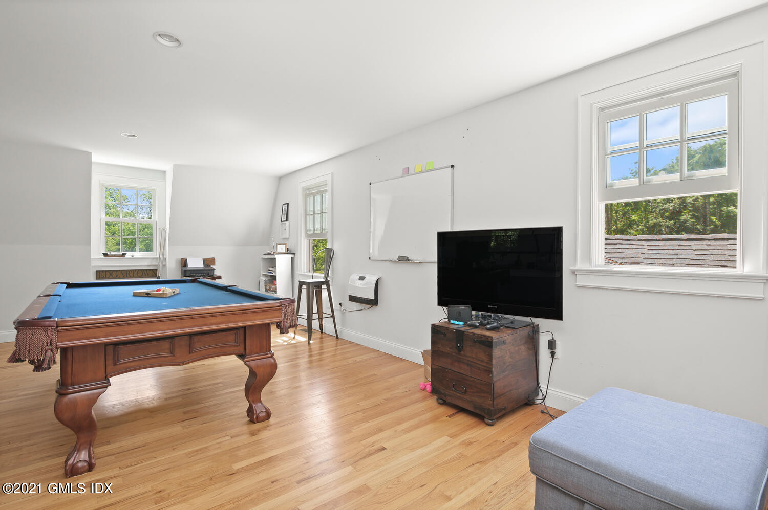 61 River Road Weston, CT 06883 - Photo 18 of 35 a living room with furniture and a flat screen tv