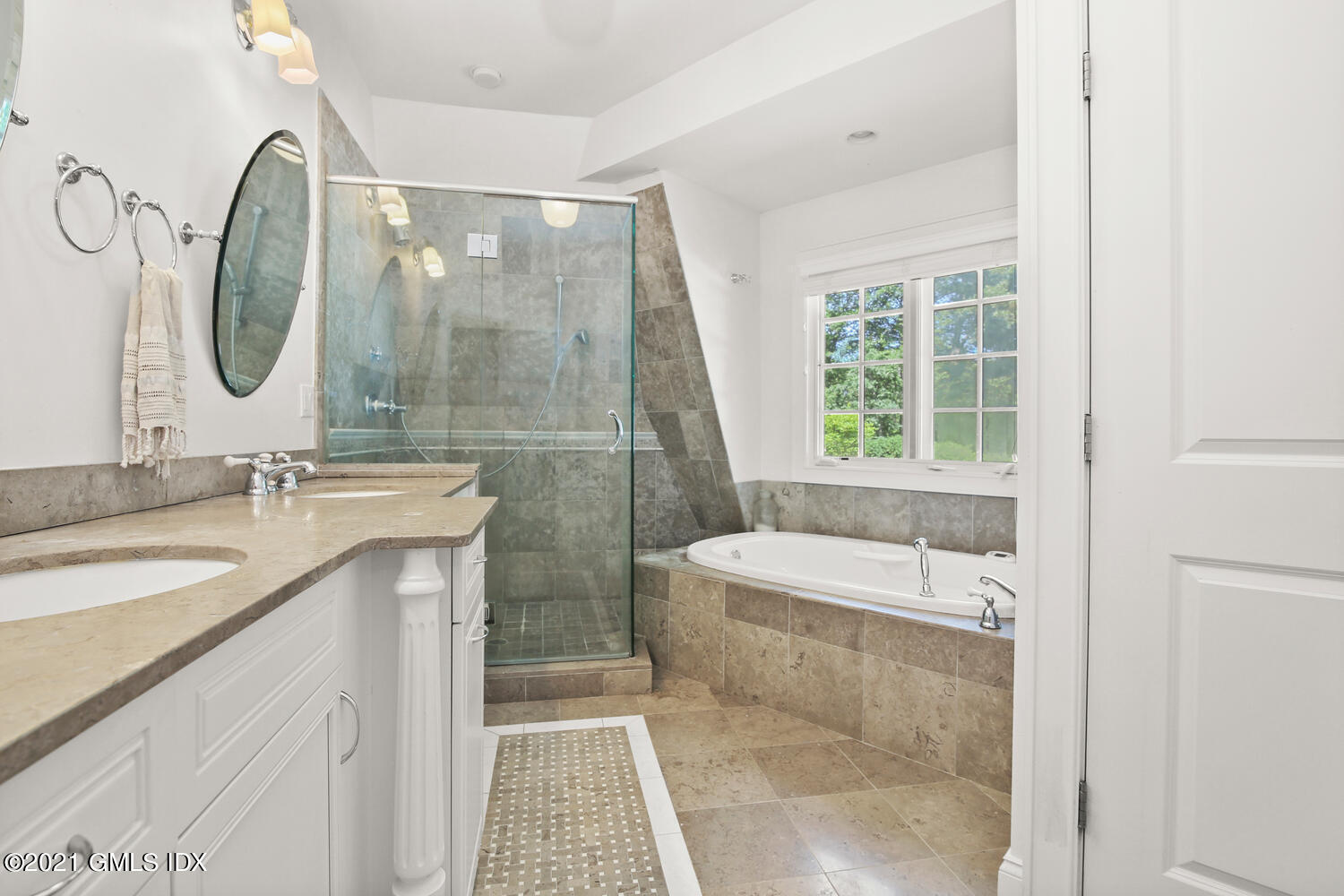 61 River Road Weston, CT 06883 - Photo 21 of 35 a bathroom with a granite countertop sink a toilet a mirror and shower