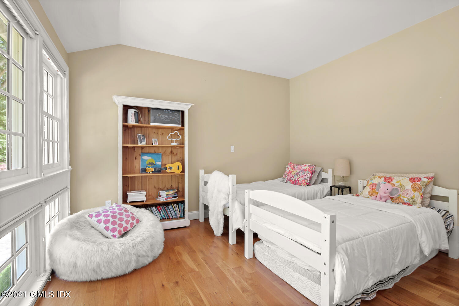 61 River Road Weston, CT 06883 - Photo 23 of 35 a bedroom with a bed and a window