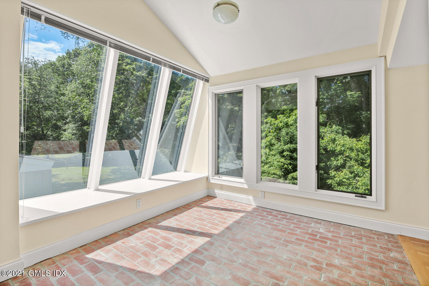 61 River Road Weston, CT 06883 - Photo 25 of 35 a view of an empty room with wooden floor and a window