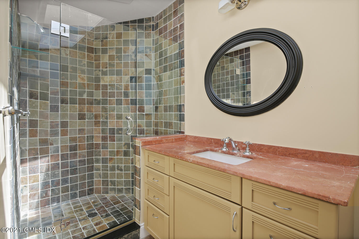 61 River Road Weston, CT 06883 - Photo 26 of 35 a bathroom with a sink a mirror and a shower