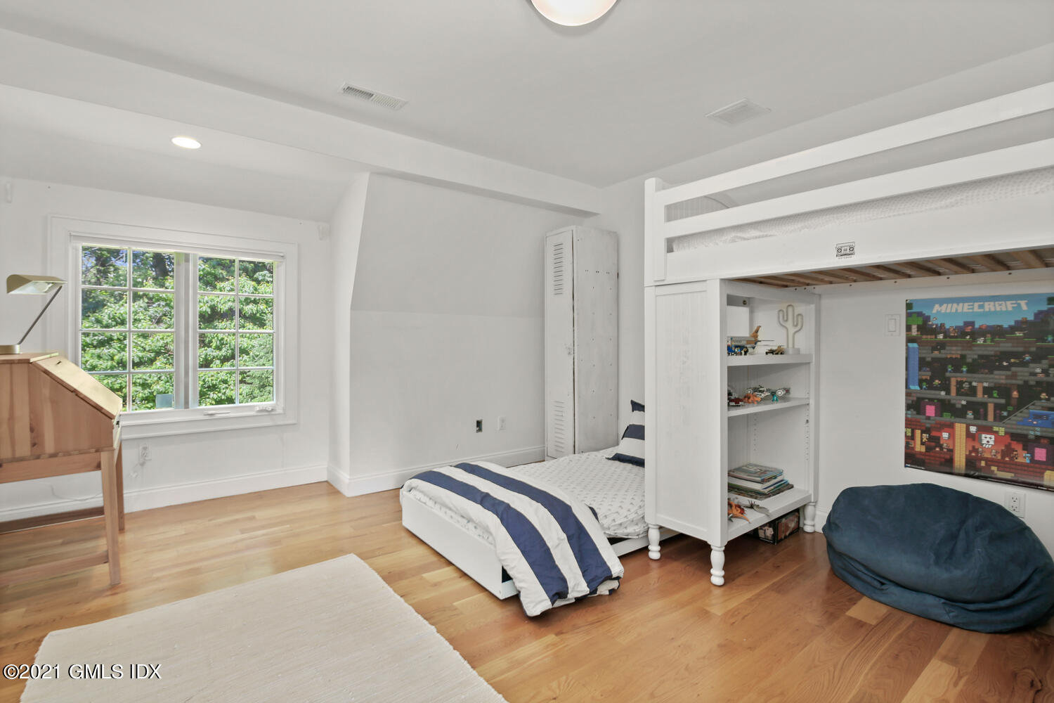 61 River Road Weston, CT 06883 - Photo 27 of 35 a bedroom with a bed and a window