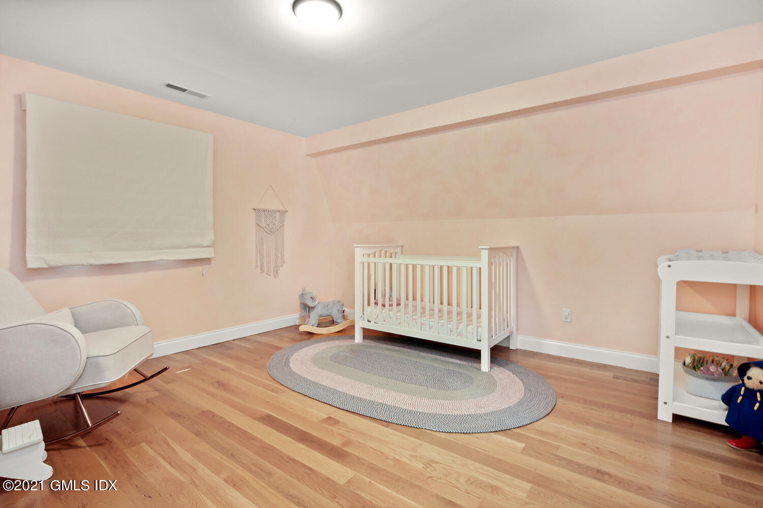 61 River Road Weston, CT 06883 - Photo 29 of 35 a room with a couch and a window