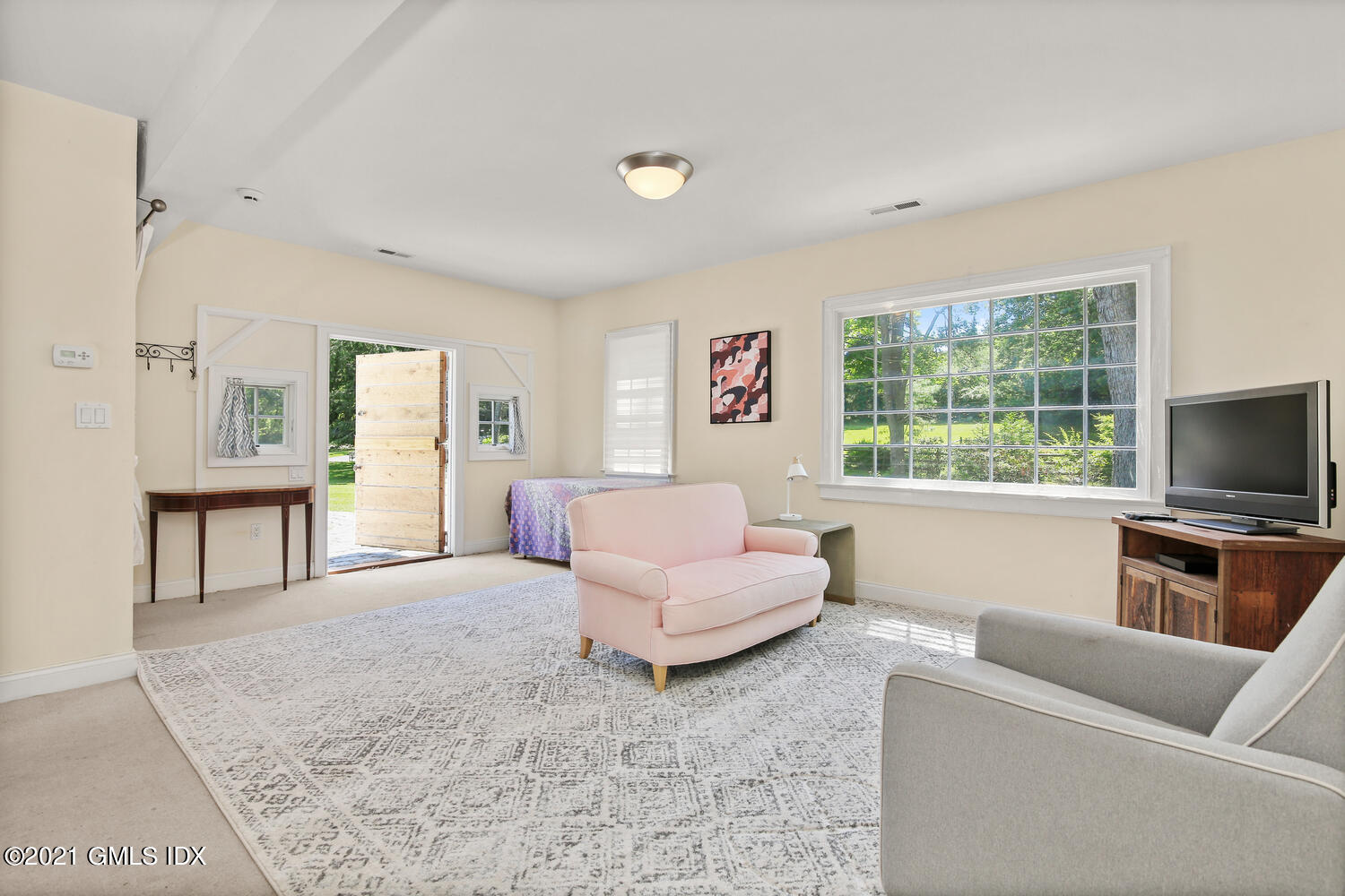 61 River Road Weston, CT 06883 - Photo 30 of 35 a living room with furniture and a flat screen tv