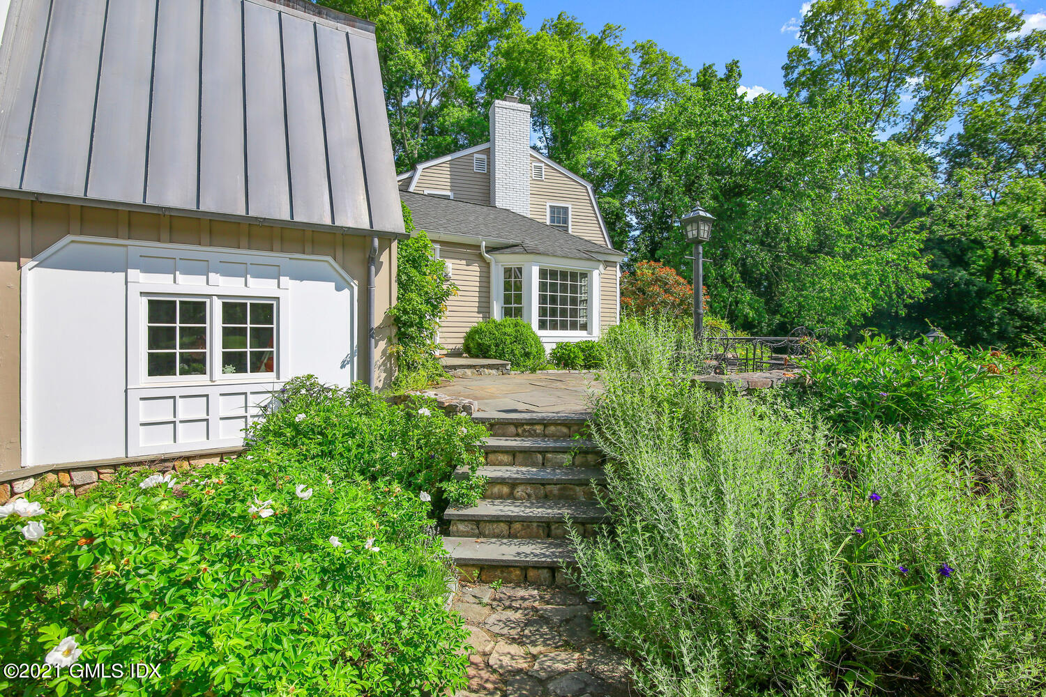 61 River Road Weston, CT 06883 - Photo 3 of 35 a front view of a house with a yard