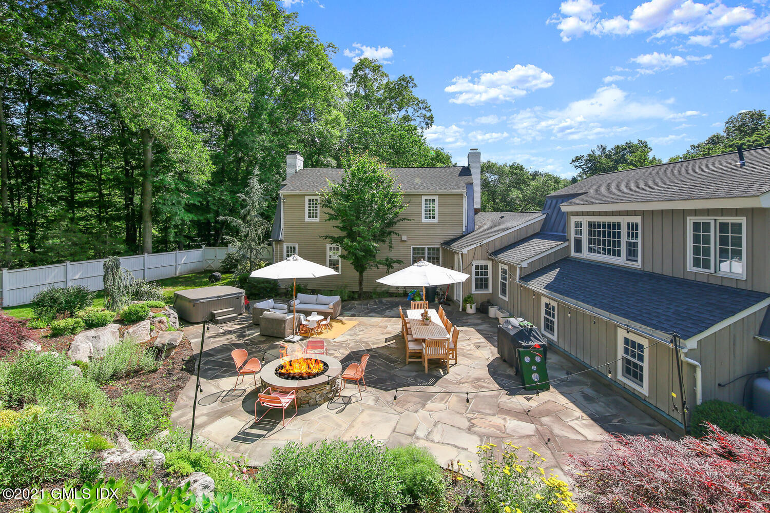 61 River Road Weston, CT 06883 - Photo 34 of 35 an aerial view of a house with garden space and sitting area
