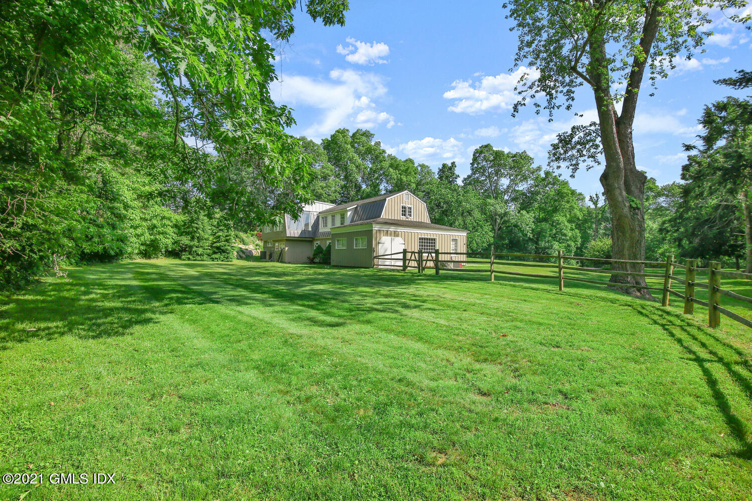 61 River Road Weston, CT 06883 - Photo 35 of 35 a view of a house with a yard