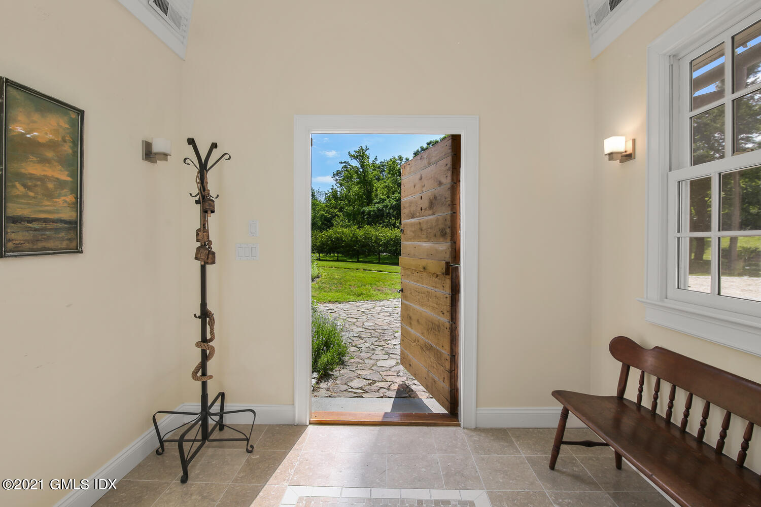 61 River Road Weston, CT 06883 - Photo 6 of 35 a view of a porch with furniture and floor to ceiling window