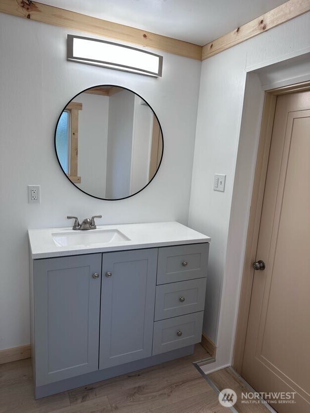 10341 184th Avenue Southwest Rochester, WA 98579 - Photo 30 of 36 a bathroom with a sink mirror vanity and toilet