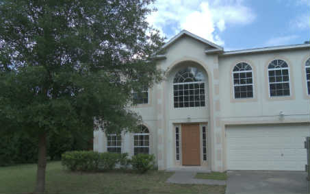 87276 Lents Road Yulee, FL 32097 - Photo 1 of 11 a front view of a house with windows and trees