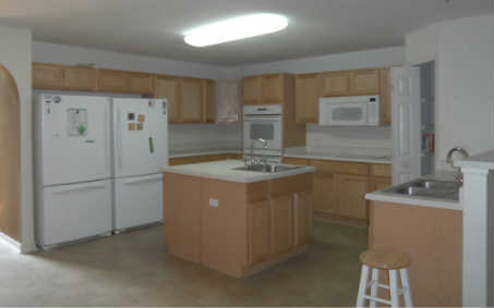 87276 Lents Road Yulee, FL 32097 - Photo 2 of 11 a kitchen with a sink refrigerator and cabinets