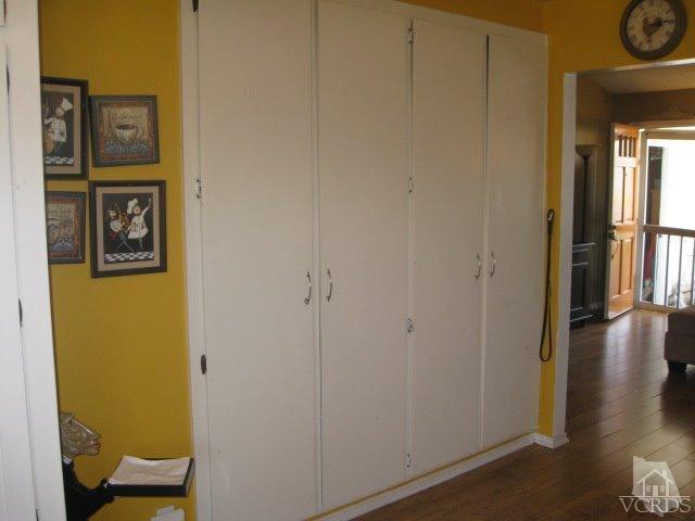 13343 Laurelhurst Road Moorpark, CA 93021 - Photo 15 of 36 a view of a hallway with wooden floor