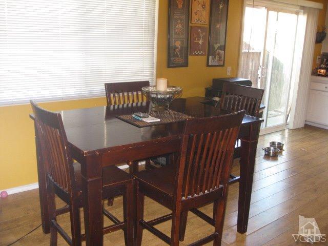 13343 Laurelhurst Road Moorpark, CA 93021 - Photo 16 of 36 a view of a dining room with furniture and wooden floor