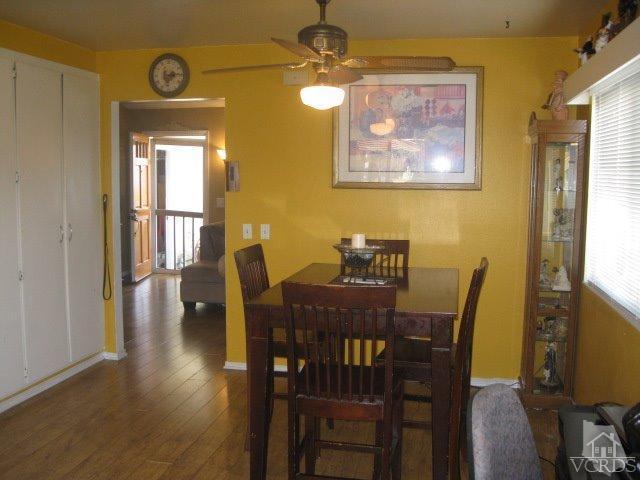 13343 Laurelhurst Road Moorpark, CA 93021 - Photo 17 of 36 a view of a dining room with furniture and wooden floor
