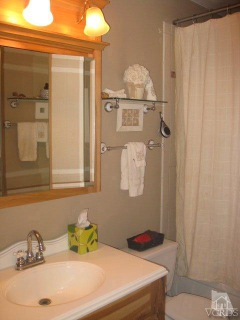 13343 Laurelhurst Road Moorpark, CA 93021 - Photo 18 of 36 a bathroom with a sink and mirror
