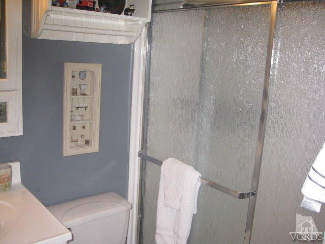 13343 Laurelhurst Road Moorpark, CA 93021 - Photo 24 of 36 a bathroom with a toilet and a shower
