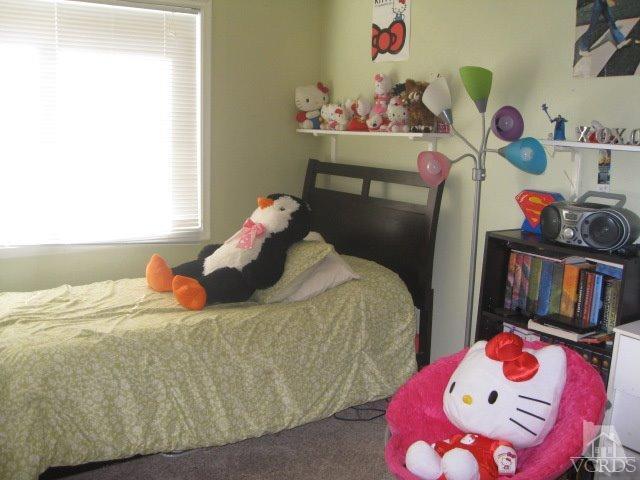 13343 Laurelhurst Road Moorpark, CA 93021 - Photo 27 of 36 a bedroom with a bed and dresser