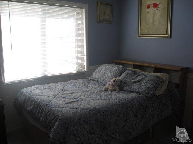 13343 Laurelhurst Road Moorpark, CA 93021 - Photo 29 of 36 a bed sitting in a bedroom next to a window