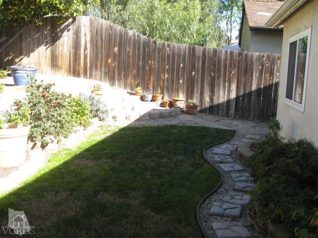 13343 Laurelhurst Road Moorpark, CA 93021 - Photo 5 of 36 a view of backyard with wooden fence and large trees