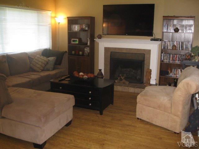 13343 Laurelhurst Road Moorpark, CA 93021 - Photo 9 of 36 a living room with furniture and a fireplace