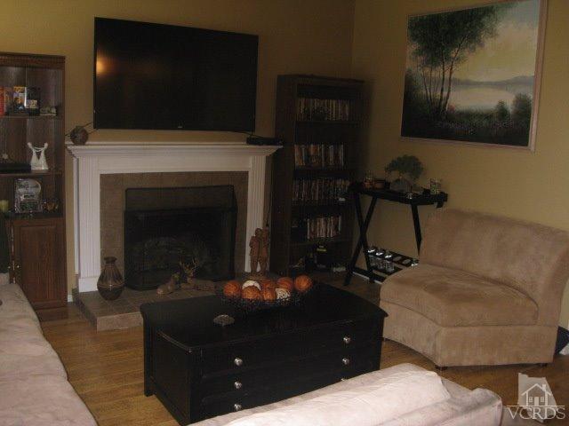 13343 Laurelhurst Road Moorpark, CA 93021 - Photo 10 of 36 a living room with furniture and a fireplace