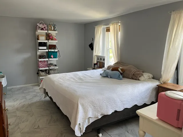 a bedroom with a bed and closet