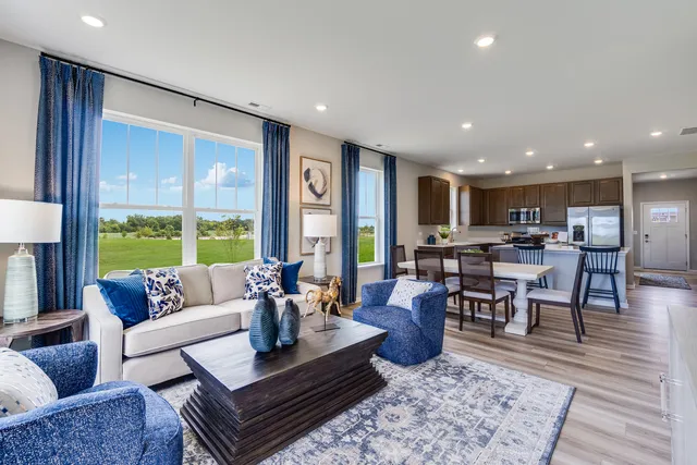 a living room with furniture and a table