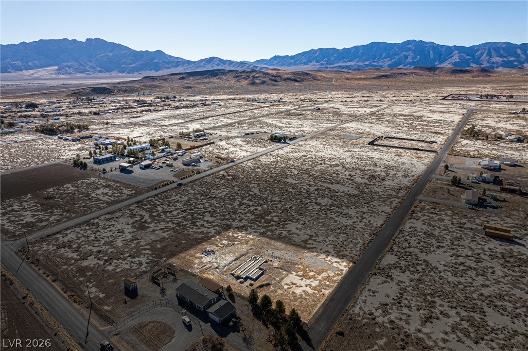 4051 Forest Road Pahrump, NV 89048 - Photo 9 of 15 A vast, undeveloped parcel of land offers scenic mountain views, ideal for future development.