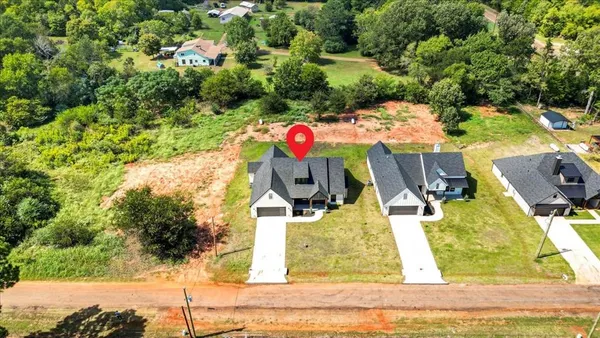 an aerial view of house with yard